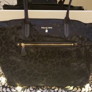Black and leopard print Michael Kors bag.